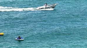 On the beach, white sand, sun-loungers, beach umbrellas