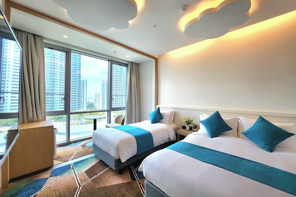 Family Twin Room | 1 bedroom, down comforters, memory foam beds, in-room safe