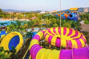 A water park with multiple slides and a large, colorful water tube ride. - Midea Egret Lake Car Theme Hotel (Foshan)