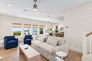 A spacious living room with a sofa, two armchairs, a coffee table, and a ceiling fan. - Blue Coast Bliss - 3BR/3.5BA Inlet Beach - Sleeps 6 - Gulf Views, Deeded Beach Access (Inlet Beach)