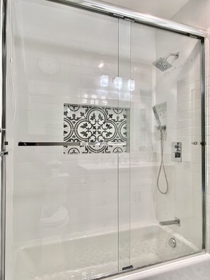 Combined shower/tub, hair dryer, towels, soap