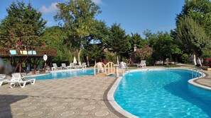 Seasonal outdoor pool, pool umbrellas, pool loungers