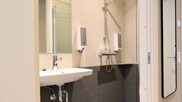 Comfort Apartment | Bathroom | Shower, towels, soap, toilet paper