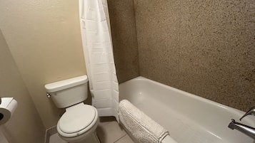 Standard Double Room, 1 Queen Bed | Bathroom | Combined shower/bathtub, hair dryer, towels, soap