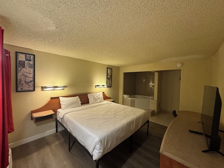 Premium Room, 1 King Bed, Jetted Tub | 1 bedroom, desk, laptop workspace, free WiFi