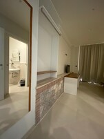 Minibar, desk, bed sheets