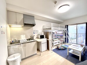 Apartment (2D) | Private kitchen | Fridge, microwave, stovetop, electric kettle - NOMAD Kiara City (Matsudo)