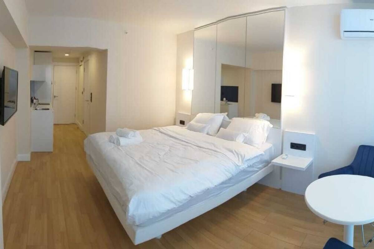 Departamento | 1 habitación, tabla de planchar con plancha, wifi gratis y ropa de cama 