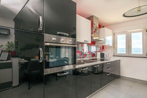 Apartment (A2) | Private kitchen | Fridge, microwave, oven, stovetop