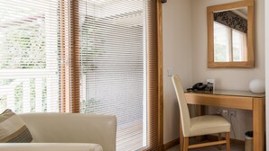A room with a desk, chair, and a sofa. - The Redgarth (Inverurie)