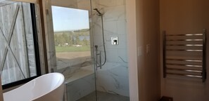 Combined shower/bathtub, hair dryer, towels, soap