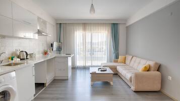 Deluxe Condo, 3 Bedrooms | Living area | 102-inch LCD TV with satellite channels, TV