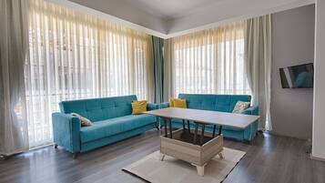 Deluxe Condo, 3 Bedrooms | Living area | 102-inch LCD TV with satellite channels, TV