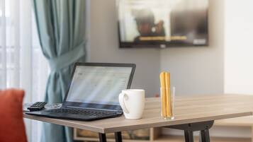 Desk, laptop workspace, soundproofing, free cots/infant beds