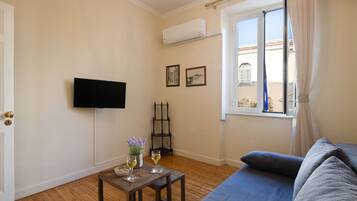 Apartment, 1 Bedroom | Living room | Flat-screen TV