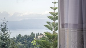 A balcony with a view of a lake and distant mountains. - Villa Southern Comfort by CorfuEscapes (Corfu)