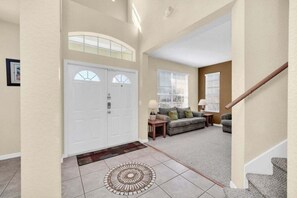 Enter a stylish living space with a sofa set, side table, and lamp.