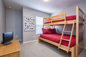 A bunk bed with a ladder, a desk with a computer, and a wall with a children's alphabet chart. - Paradise Palms-4 Bed Townhome W/spashpool-3015pp 4 Bedroom Townhouse by RedAwning (Kissimmee)