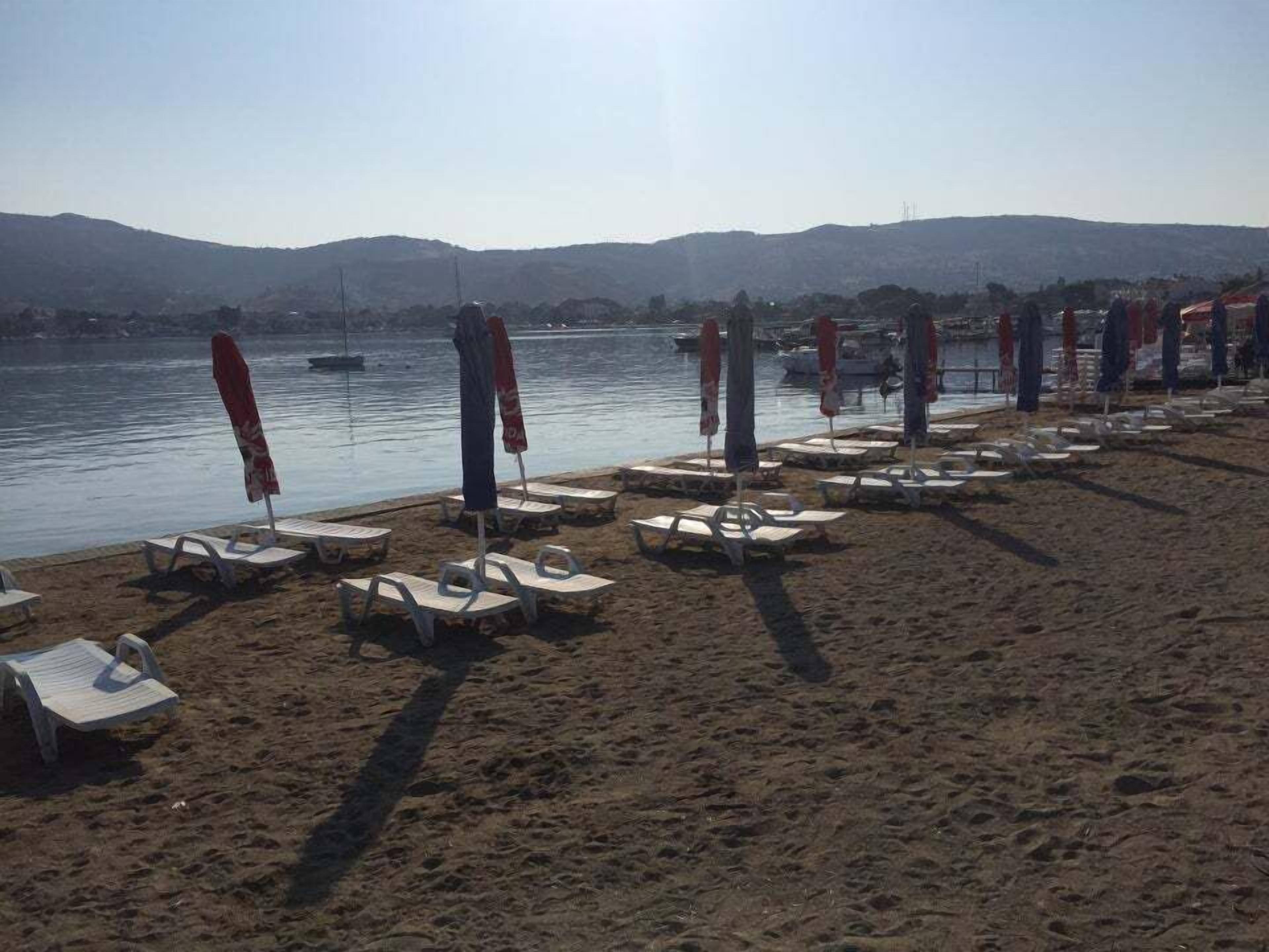 private beach, free beach shuttle, sun-loungers, beach umbrellas