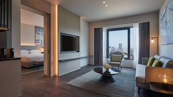 Suite, 1 slaapkamer | Woonkamer | Flatscreentelevisie