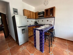 Fridge, microwave, stovetop, coffee/tea maker