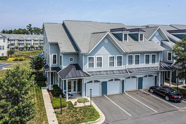 Home entrance is first front door, next to first garage on the left