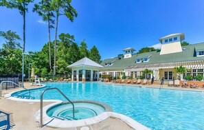 A large outdoor swimming pool with a hot tub, lounge chairs, and a gazebo. - Waterfront Marina Home on Private Golf Resort & Pool - 4 miles to OC Boardwalk (Berlin)
