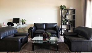 Exclusive Apartment, 2 Bedrooms | Living area | 52-inch Smart TV with digital channels, TV, Netflix
