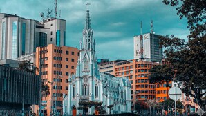 A historic cathedral with intricate architecture, surrounded by modern buildings. - Excellent Apartment With the Best Location in the City (Cali)