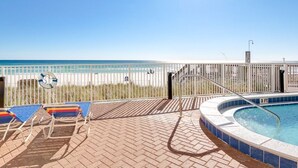 A pool area with a view of the beach, a lifeguard chair, and a hot tub. - LUXURY 20TH FLOOR BEACHFRONT CONDO/HUGE BALCONY/BEACH SERVICE/5 STAR REVIEWS (Panama City Beach)