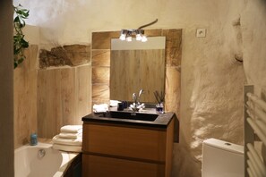 Bathtub, hair dryer, towels, soap