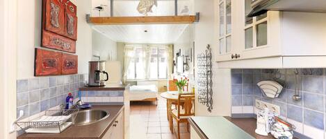 Fridge, microwave, stovetop, coffee/tea maker