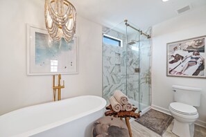 Bathtub, hair dryer, towels, soap
