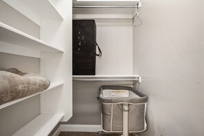 A storage closet with shelves, a black appliance, and a trash bin. - Private heated pool/hot tub, pickleball mini golf. 9 Bdrms. 4 bath. EV charger. (La Verkin)