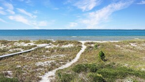 A beach path leading to the ocean with clear skies. - Beachfront, Quiet shoreline ~ Flamingo Dunes (St. Joe Beach)