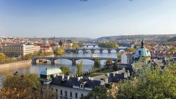 A cityscape with a river, bridges, and historic buildings.