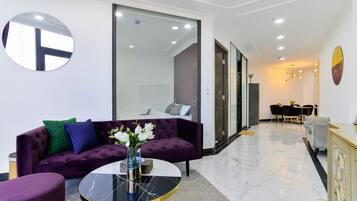 Panoramic Apartment, 2 Bedrooms | Living room | 55-inch Smart TV with cable channels, TV