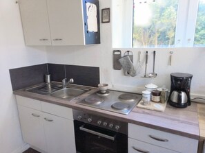 Fridge, stovetop, coffee/tea maker, electric kettle