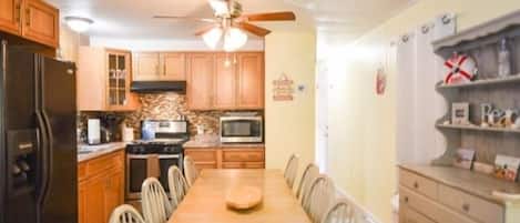 Fridge, microwave, stovetop, cookware/dishes/utensils