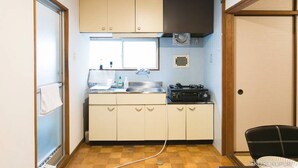 A compact kitchen with a sink, stove, and cabinets. - Dai3Himawari  401 (Hiroshima)