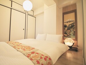 Condo, 2 Bedrooms (503) | Individually decorated, desk, laptop workspace, iron/ironing board - Dai3Himawari Building 503 (Hiroshima)