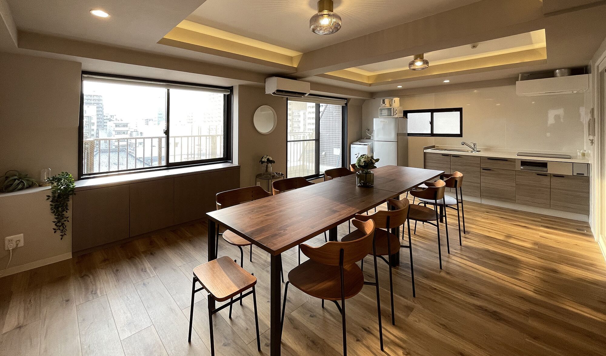 A modern kitchen with a dining area.