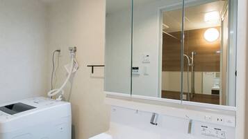 Condo, 1 Bedroom (303) | Bathroom | Combined shower/tub, deep soaking tub, free toiletries, hair dryer