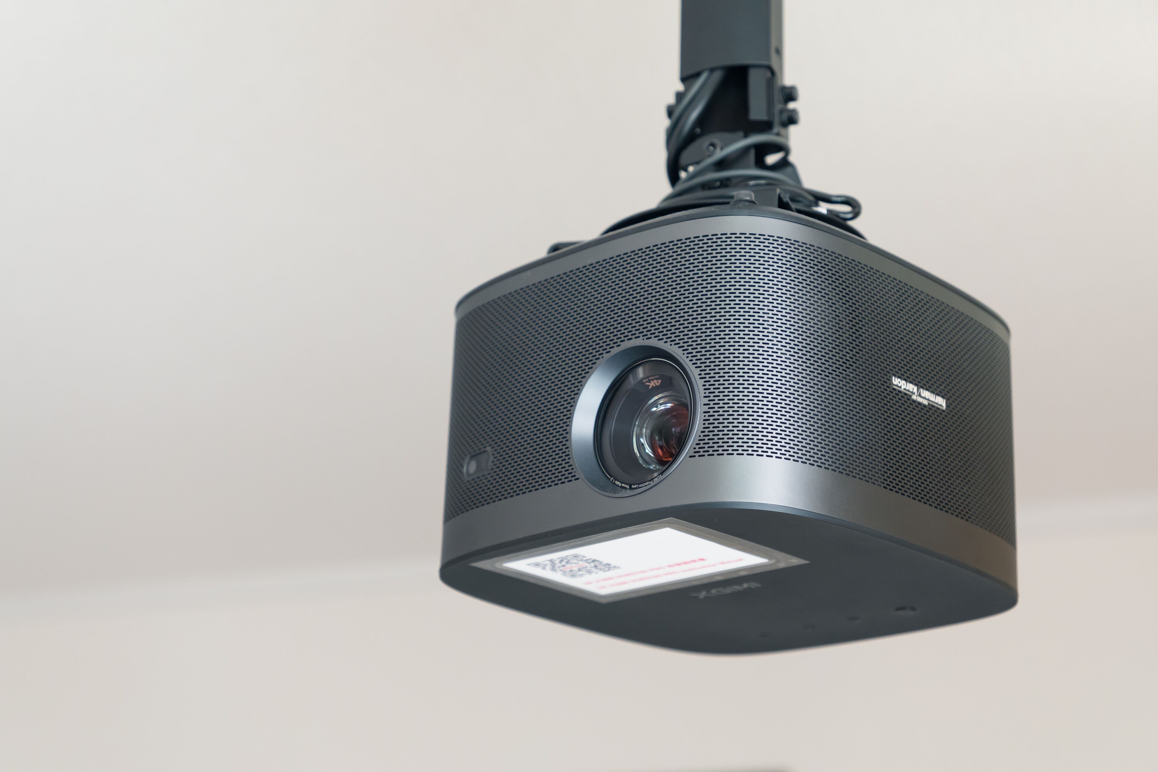 A projector with a QR code and a lens.