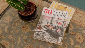 A magazine titled '50 Dream Rooms' on a table with a potted plant. - JOIVY Heart of The Royal Mile (Edinburgh)