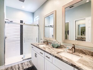 Combined shower/bathtub, hair dryer, towels, toilet paper