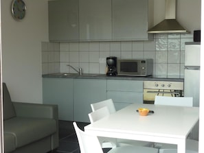 Fridge, microwave, cookware/dishes/utensils