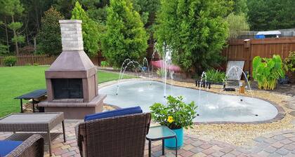 Spacious suite with fenced back yard, deck, gas grill, fireplaces and splash pad