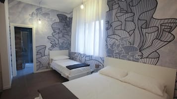 Triple Room | Minibar, in-room safe, desk, soundproofing