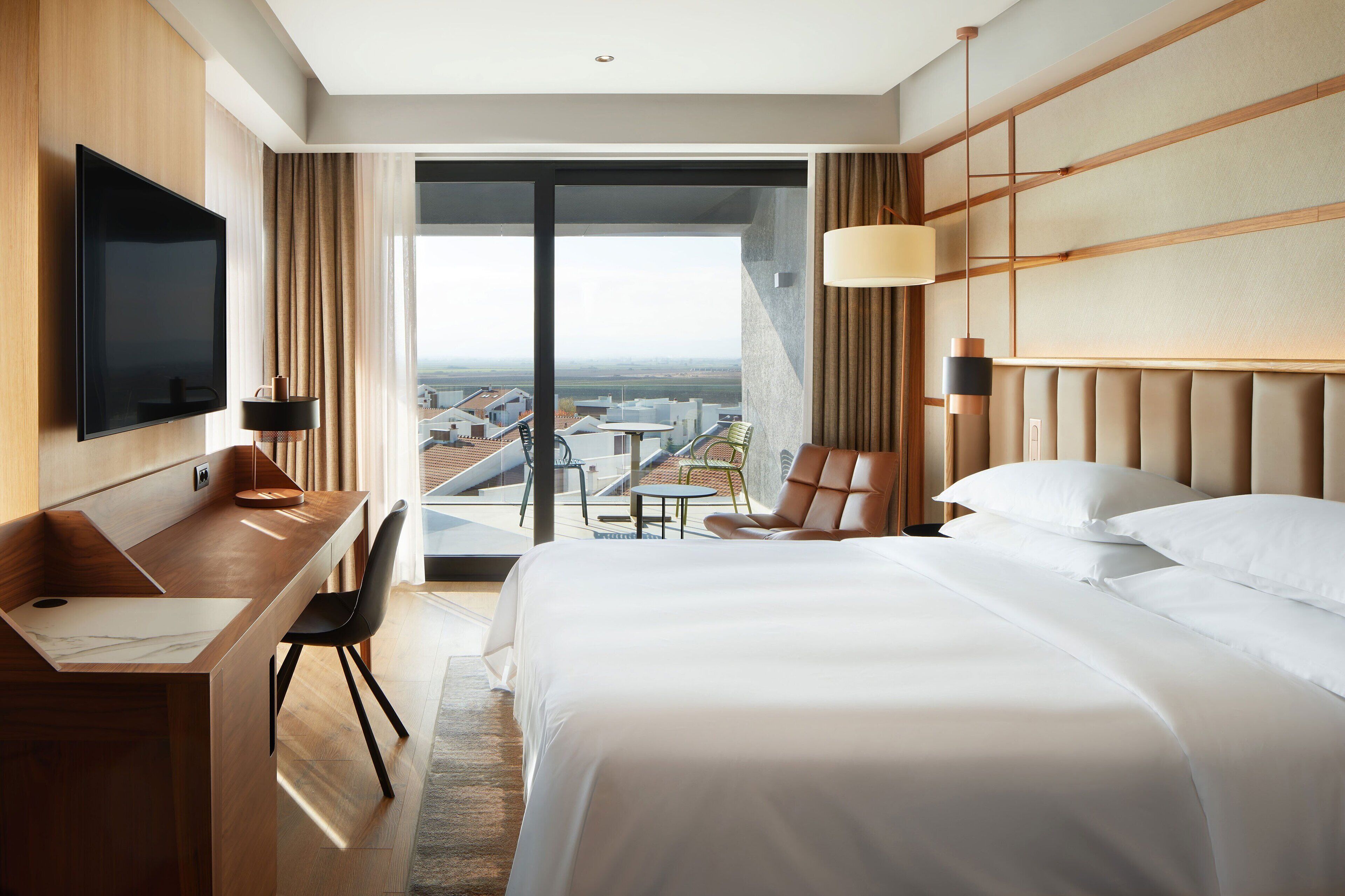 premium room, 1 king bed, terrace, corner | in-room safe, desk, laptop workspace, blackout curtains